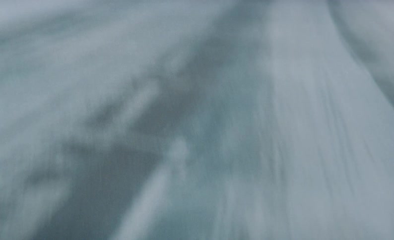 A close up of a salt covered road during winter