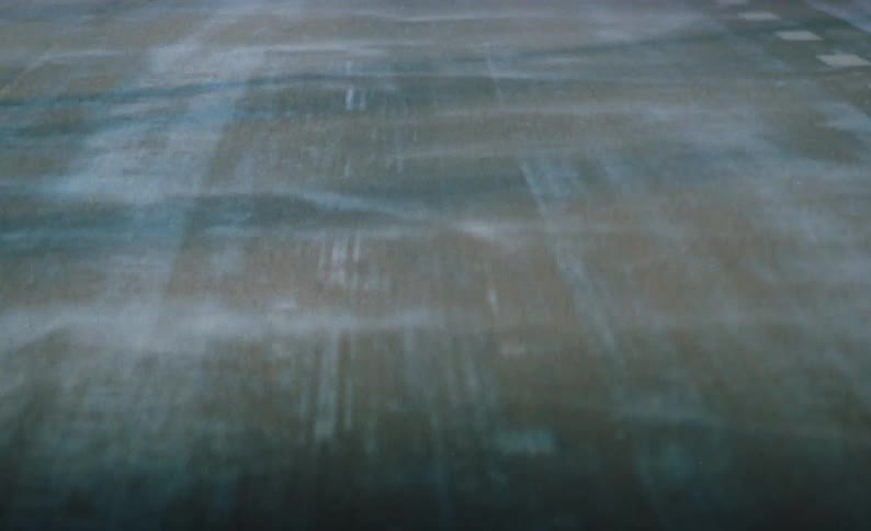 The wind blows the ice on the road