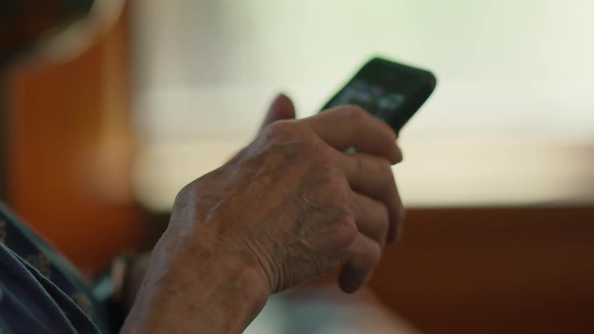 Old man using a phone