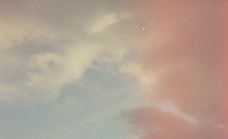 A view of a sunset with clouds