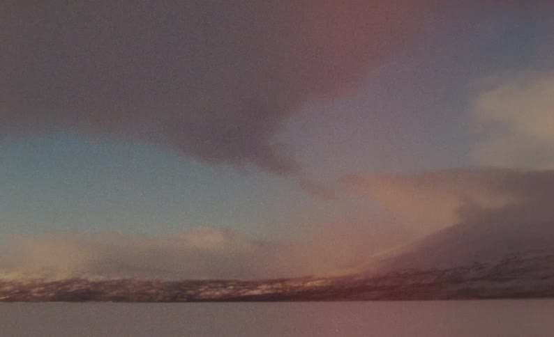 Clouds over a snowy view of the horizon