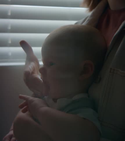 A mother wipes a babies face