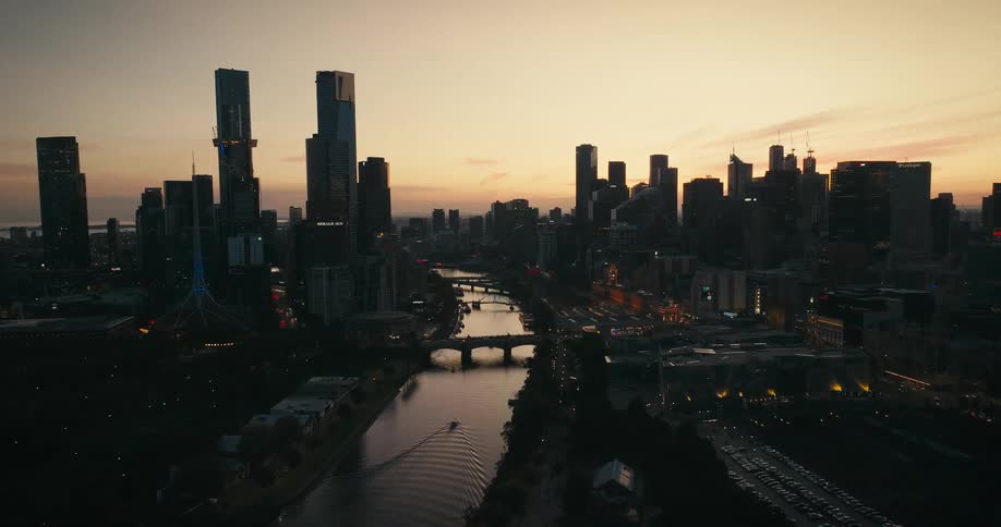 An aerial view of a city with a river in the middle of it