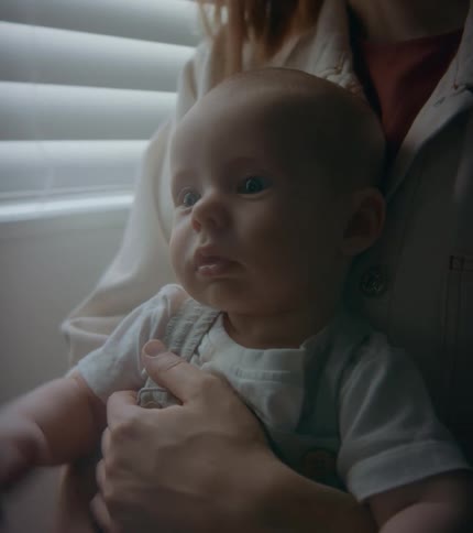 A mother holding a baby