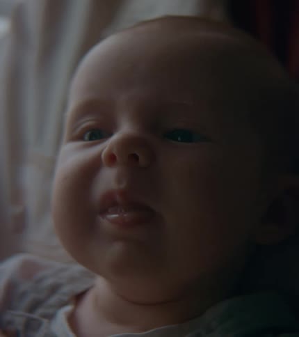 An up close of a babies fussy face