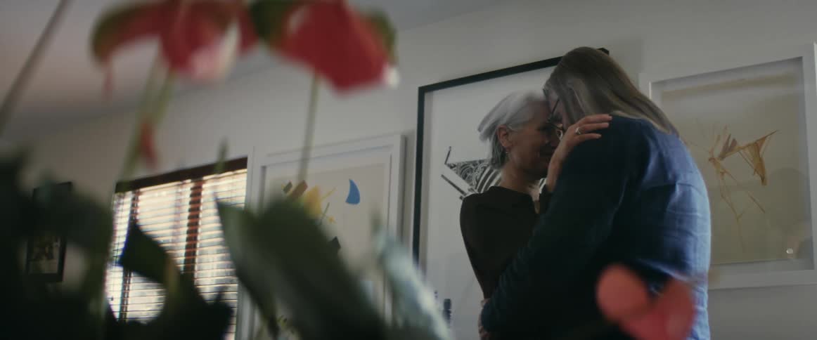 Two people dancing with each other in a house