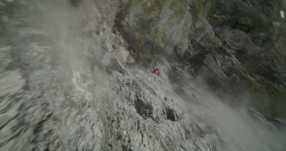 A person is doing a recreation activity in a mountainous area