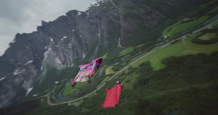 Two gliders sailing through the air almost on top of each other