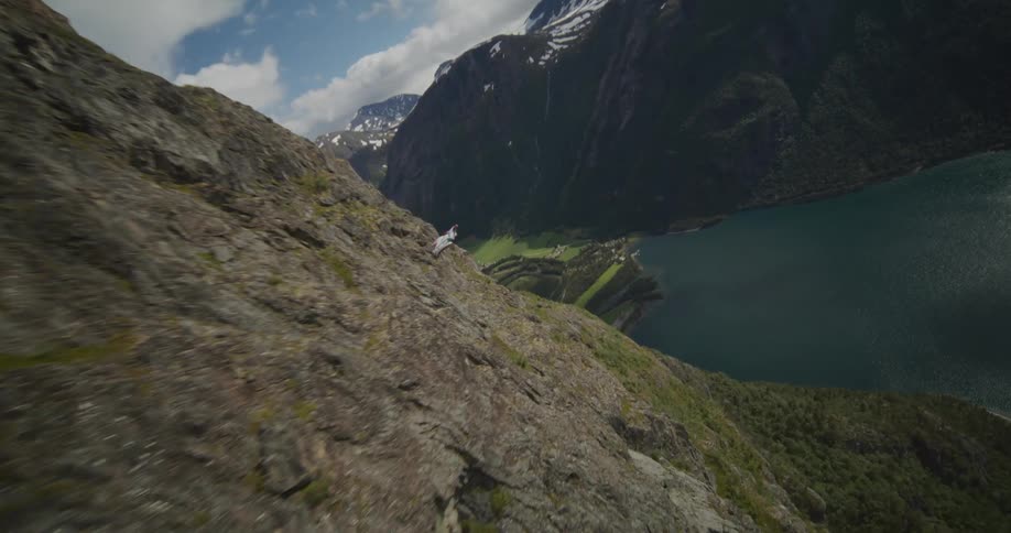 An aerial view of a person base jumping