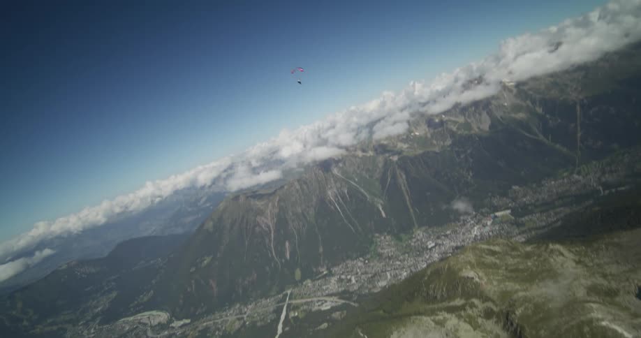 The view is of someone in a parachute around the nature area