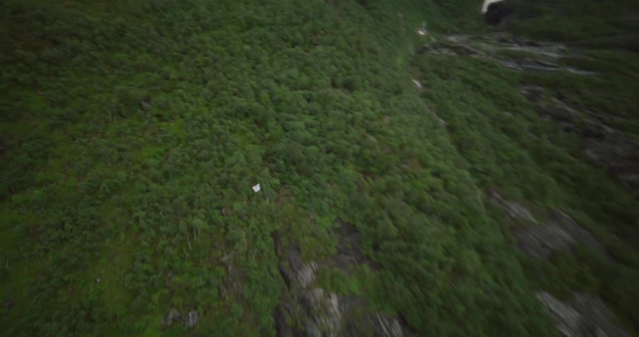 Wingsuit flying close to rocks and doing tricks