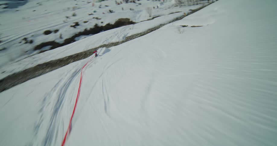 Multiple shots of two skiers that are going down a pike before finishing their set on at the park
