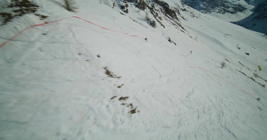 People are skiing outdoors in the middle of the day
