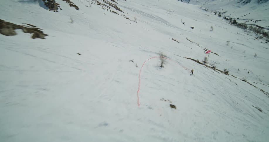 The view is of people skiing on a hill around winter time