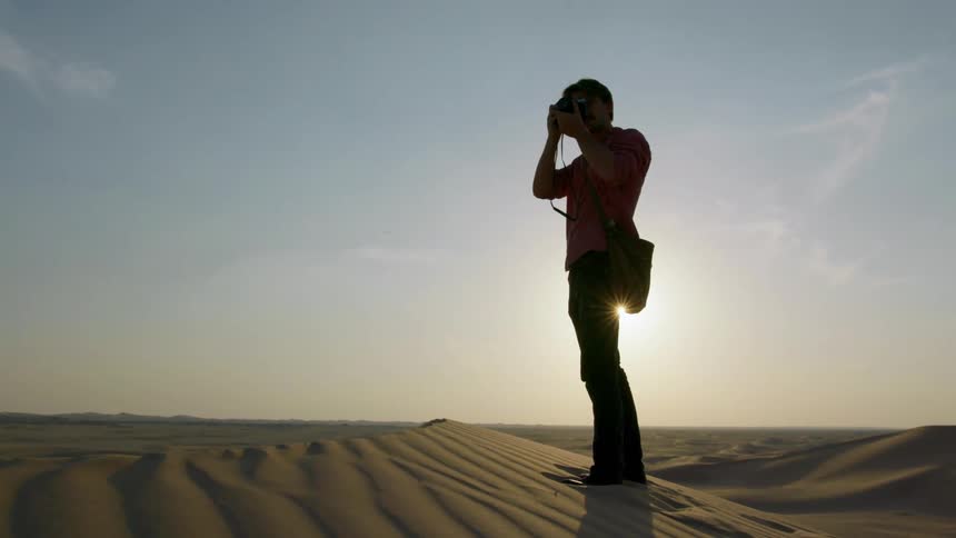 A man standing in the stand takes photographs