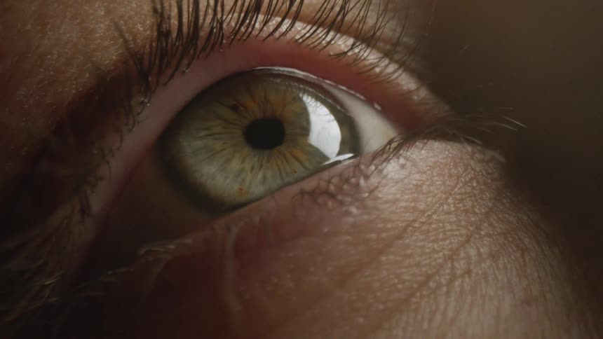 Close up of woman opening her eye