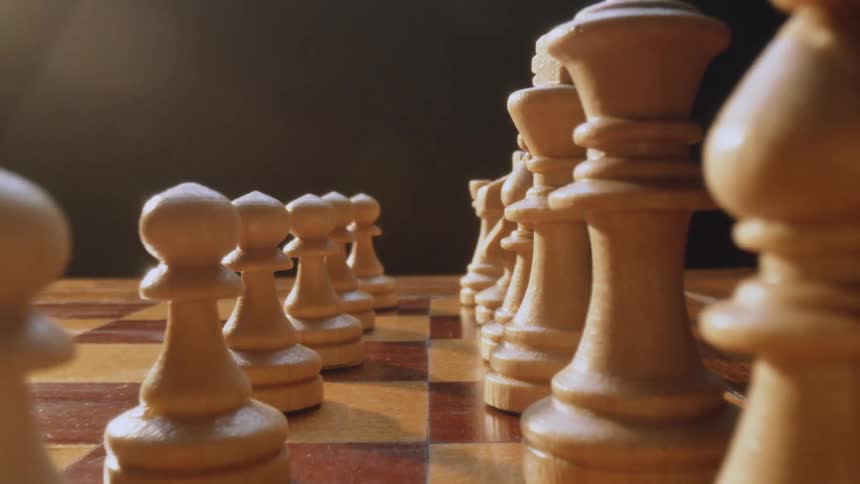 Close up of chessboard with pawn castle knight bishop queen and king