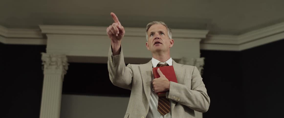 A preacher is speaking in the room