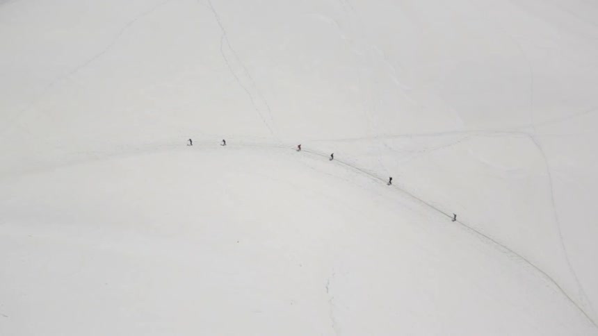 People skiing along a snow-covered landscape