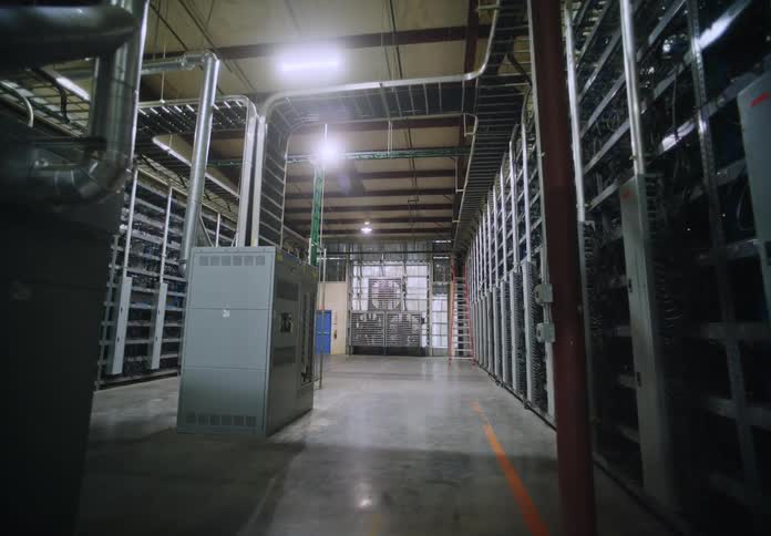 Walking through large warehouse with servers