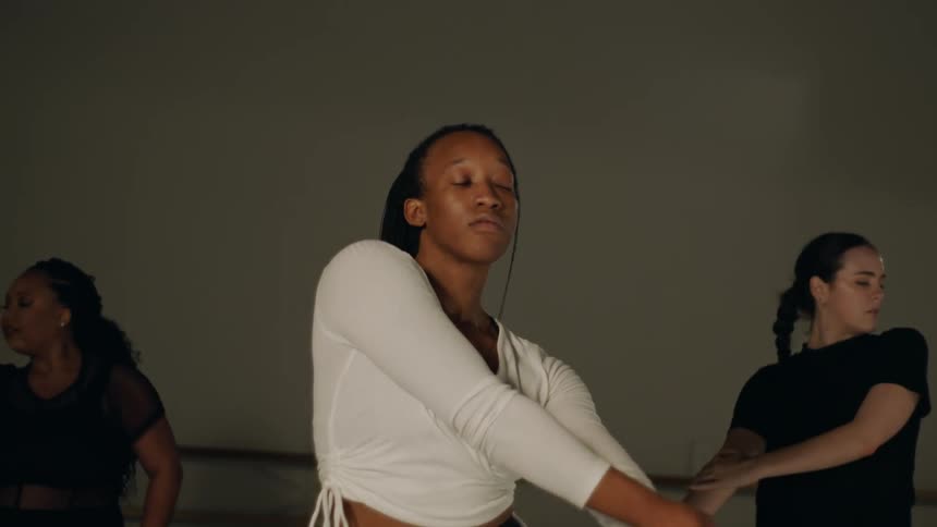 Three female dancers rehearsing in a dance studio