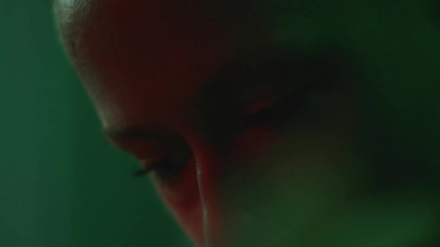 Close up view of a womans face is displayed indoors