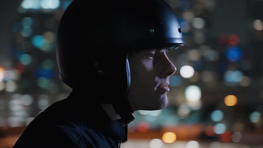 A man straps on a helmet