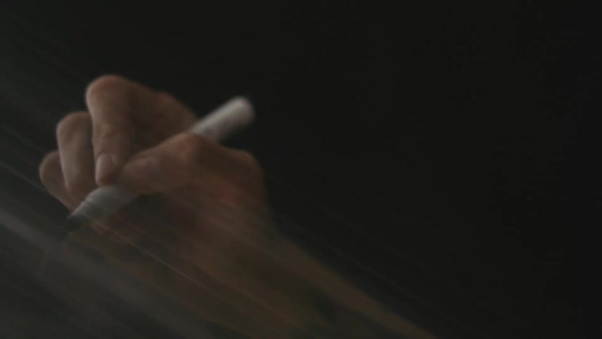 Close up view of a person drawing is displayed