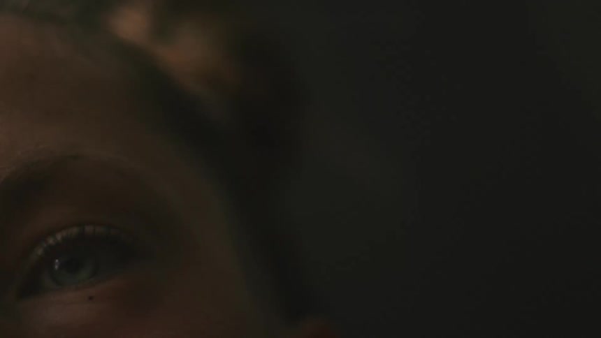 Close up view of a female face is displayed