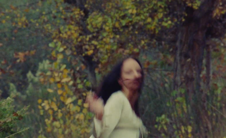 Woman doing something in the woods