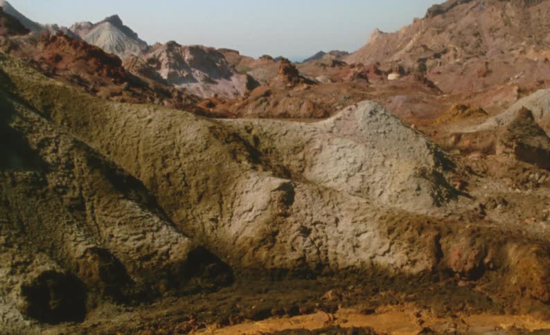 A view of a rocky landscape is displayed during the day time