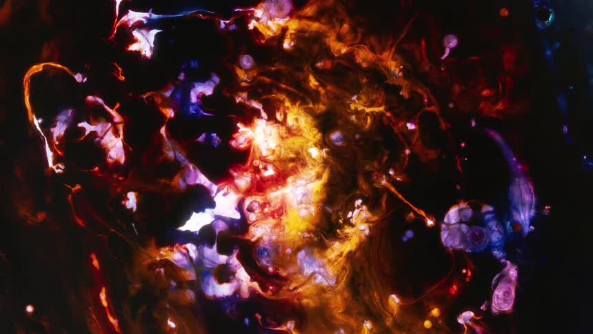 Streaks form and fade as vivid multihued mass shifts and moves