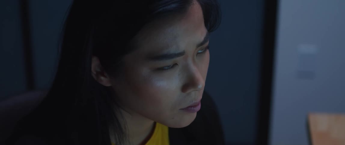 A woman works at her desk in the office