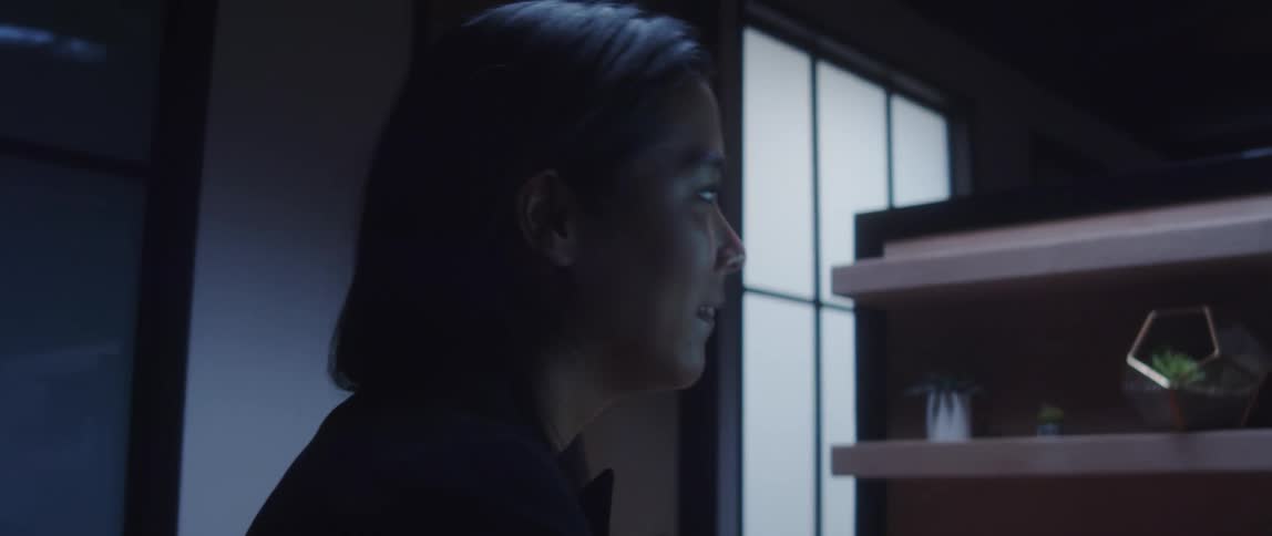 Female employee saying goodbye to male colleague as he leaves the office