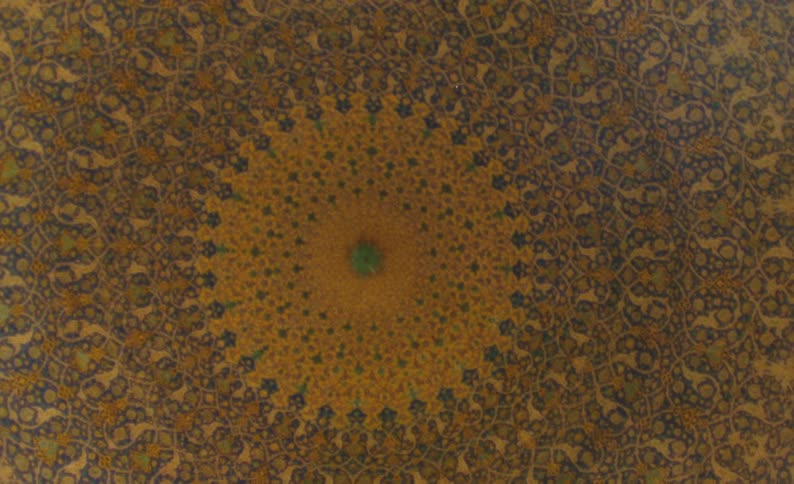 Detailed complex pattern moves out in layers from mostly yellow center