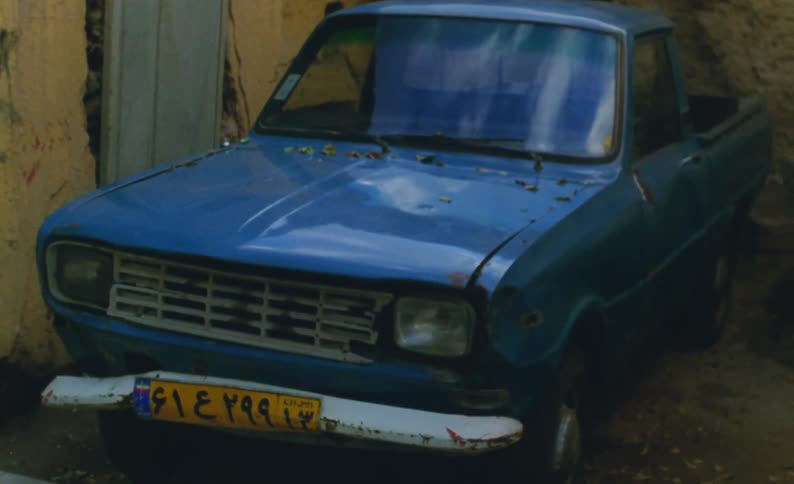 A view of a car parked on a road