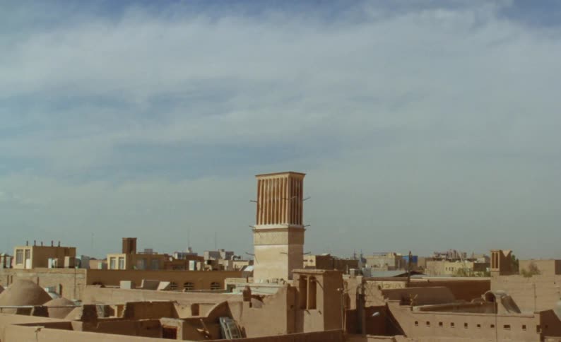 A view of a tower in a town outdoors