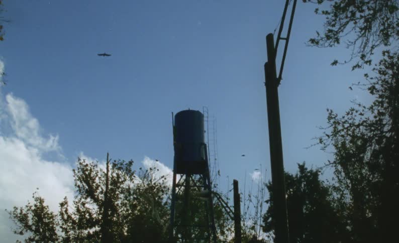 Old water tower against the blue sky