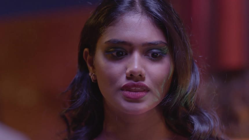 A closeup of a camera on a indian woman