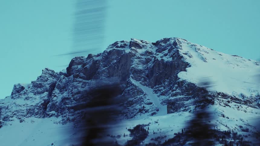 Landscape of high snowy mountain and forest