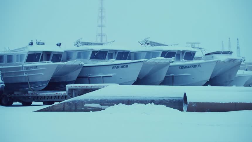 A view of ships sitting on trailers in the snow