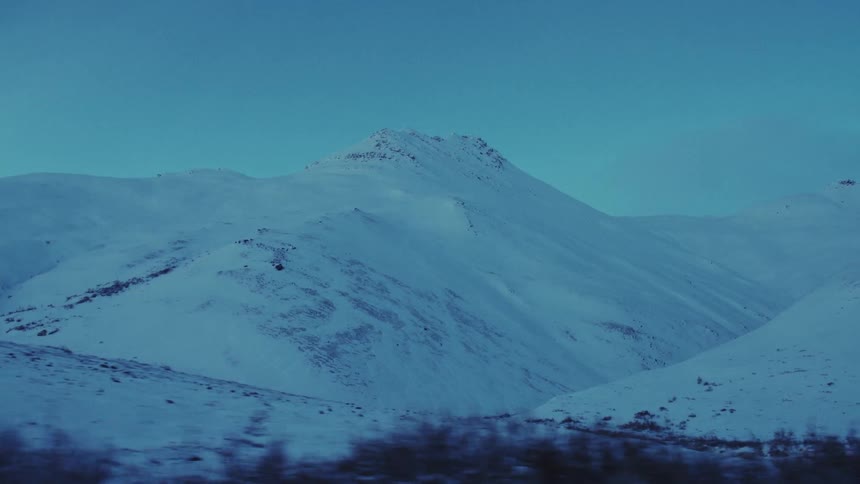 A view of a mountain covered in snow