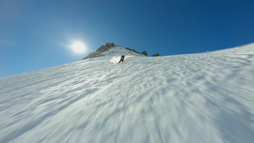 A man is skiing down the mountain