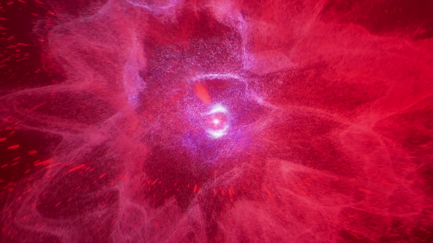 A close up of an explosion of particles