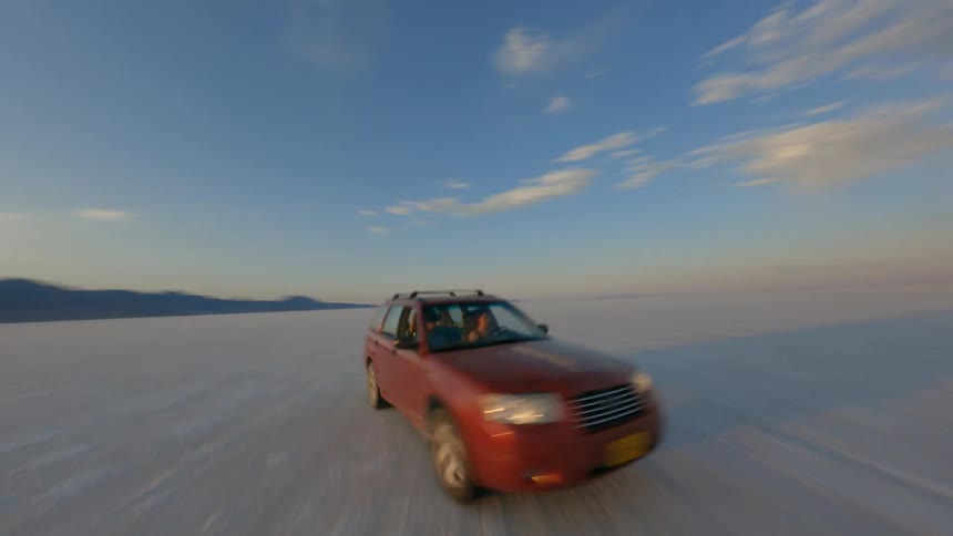 A car is driving over the landscape