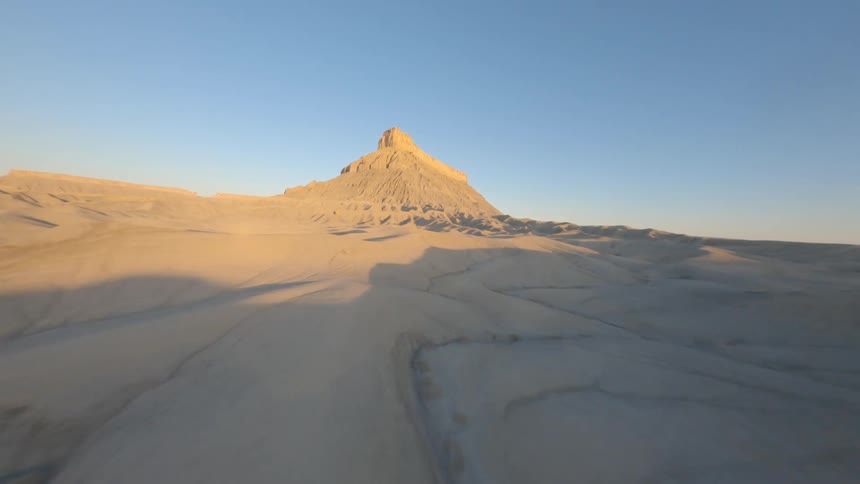 The long desert leads to a mountain