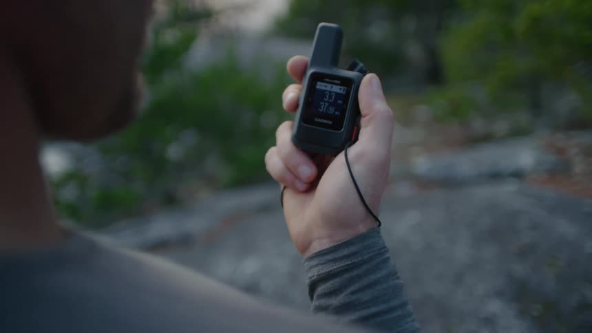 A man is holding a sound recorder