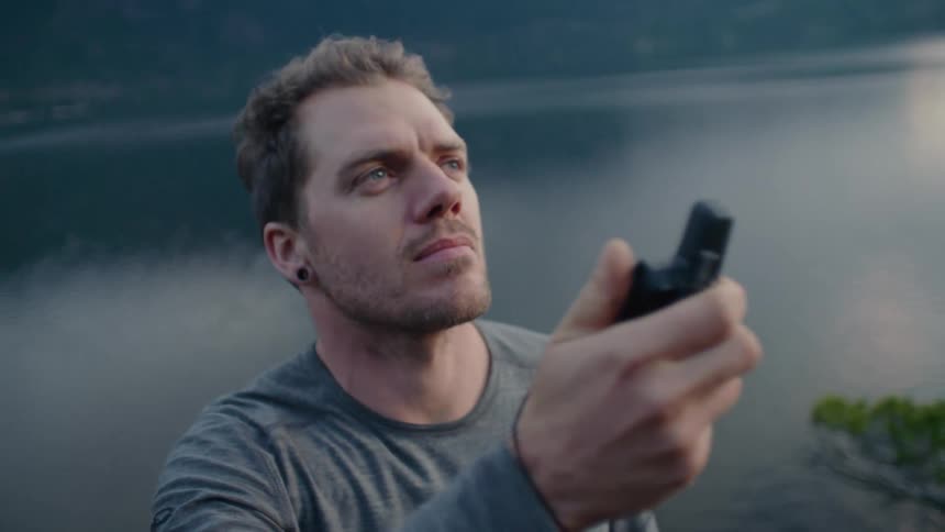 A man waves around a recording device