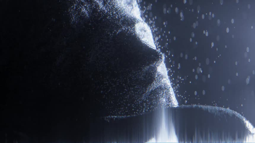 Computer generated special effects shot of a human male face decomposing in particles