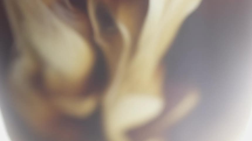 Milk swirling in coffee